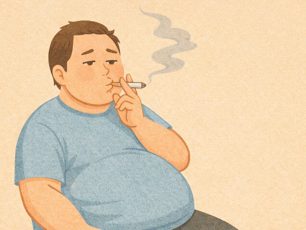 太っている喫煙者の写真