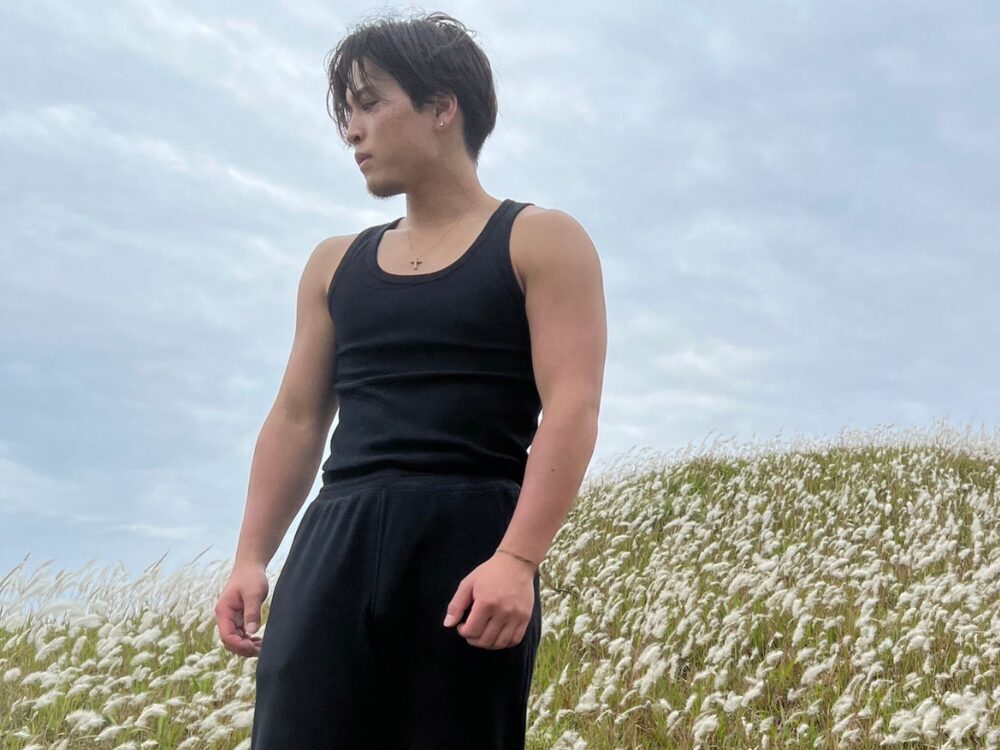 前田トレーナーが食事管理をする前のタンクトップ姿の写真