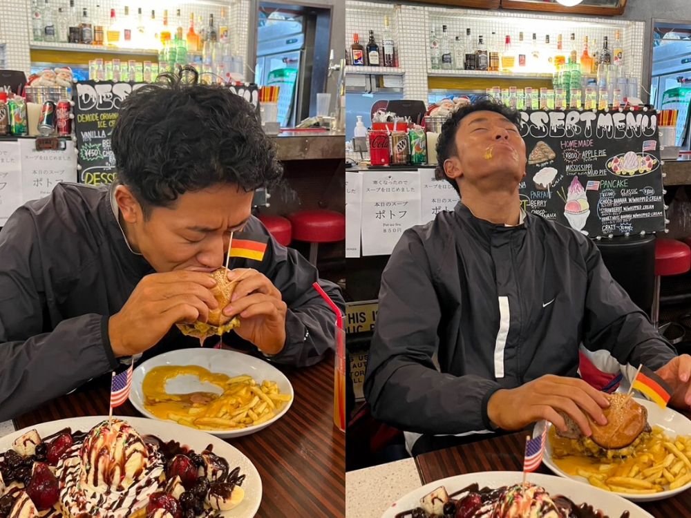 ハンバーガーを食べて泣いている山下